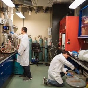 Ph.D. students Beau Schlageter, left, and Petr Kolosov, right, working at a lab in the chemical engineering department at McGill University in Montreal. (Photograph by Dario Ayala)