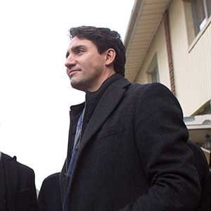 Prime Minister Justin Trudeau (right) stands with Jason Chen, Development Director at Toronto Community Housing as he visits a housing development in Toronto's Lawrence Heights neighbourhood ahead of a policy announcement, on Wednesday November 22, 2017. THE CANADIAN PRESS/Chris Young