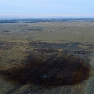 This aerial photo shows spills from TransCanada Corp.'s Keystone pipeline, Friday, Nov. 17, 2017, that leaked an estimated 210,000 gallons of oil onto agricultural land in northeastern South Dakota, near Amherst, S.D., the company and state regulators said Thursday, but state officials don't believe the leak polluted any surface water bodies or drinking water systems. Crews shut down the pipeline Thursday morning and activated emergency response procedures after a drop in pressure was detected resulting from the leak south of a pump station in Marshall County, TransCanada said in a statement. The cause was being investigated. (DroneBase/AP/CP)