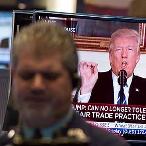 Traders work on the floor at the closing bell of the Dow Industrial Average at the New York Stock Exchange on November 15, 2017 in New York, as US President Donald Trump delivers a televised statement from the White House. / AFP PHOTO / Bryan R. Smith (Photo credit should read BRYAN R. SMITH/AFP/Getty Images)