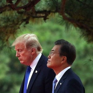 SEOUL, SOUTH KOREA - NOVEMBER 07: South Korean President Moon Jae-In (R) and U.S. President Donald Trump (L) walk during a welcoming ceremony held at the presidential Blue House on November 7, 2017 in Seoul, South Korea. Trump is in South Korea as a part of his Asian tour. (Photo by Chung Sung-Jun/Getty Images)