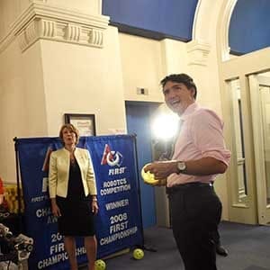 Prime Minister Justin Trudeau and new Chief Science Advisor Dr.Mona Nemer check out a robot that fires balls with science fair participants Van Bernat and Kate O'Melia of Governor Simcoe Secondary School in St.Catharines, Ont., on Parliament Hill in Ottawa on Tuesday, Sept.26, 2017. THE CANADIAN PRESS/Sean Kilpatrick