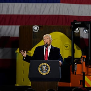 CORAOPOLIS, PA - JANUARY 18: President Donald Trump speaks to supporters at a rally at H&K Equipment, a rental and sales company for specialized material handling solutions on January 18, 2018 in Coraopolis, Pennsylvania. Trump visited the facility for a factory tour and to offer remarks to supporters and employees following the administration's new tax plan. (Photo by Jeff Swensen/Getty Images)
