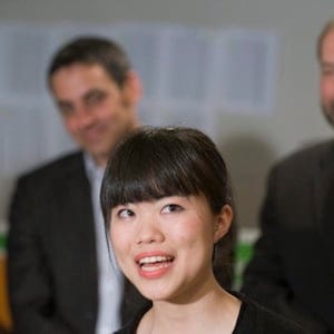 Newly-elected NDP MP Laurin Liu speaks to reporters during a post-election news conference in Montreal, Tuesday, May 3, 2011, as fellow MP Pierre Nantel and NDP deputy leader Thomas Mulcair, right, look on.THE CANADIAN PRESS/Graham Hughes