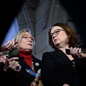 Minister of Crown-Indigenous Relations and Northern Affairs Carolyn Bennett, left, and Minister of Indigenous Services Jane Philpott speak to reporters after meetings with the family of Colten Boushie, in the Foyer of the House of Commons on Parliament Hill in Ottawa on Monday, Feb. 12, 2018. THE CANADIAN PRESS/Justin Tang