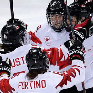 Marie-Philip Poulin (29), of Canada, celebrates with her teammates after scoring a goal against the team from Russia during the second period of the semifinal round of the women's hockey game at the 2018 Winter Olympics in Gangneung, South Korea, Monday, Feb. 19, 2018. THE CANADIAN PRESS/AP-Julio Cortez