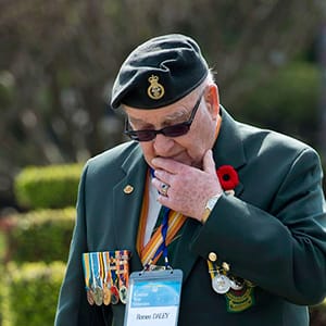 Canadian Korean War veteran Romeo Daley walks through the United Nations Memorial Cemetery following a ceremony Friday April 26, 2013 in Busan, Republic of Korea. THE CANADIAN PRESS/Adrian Wyld