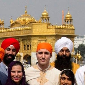 Prime Minister Justin Trudeau, centre, stands beside Surrey Centre MP Randeep Sarai, top centre right, as they join fellow MPs for a group photo while visiting the Golden Temple in Amritsar, India on Wednesday, Feb. 21, 2018. THE CANADIAN PRESS/Sean Kilpatrick