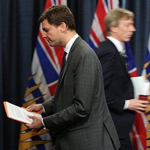 Attorney General David Eby leaves the podium after speaking to media about the legislation announcement banning union and corporate donations to political parties during a press conference at Legislature in Victoria, B.C., on Monday, September 18, 2017. THE CANADIAN PRESS/Chad Hipolito