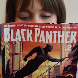 In this photo illustration a woman reads a copy of the Black Panther (T'Challa) a fictional superhero appearing in comic book published by Marvel Comics in New York May 17, 2016.
Captain America and Iron Man may be the stars of Marvel's latest comic-book blockbuster, but Black Panther -- making his big-screen debut -- is most definitely the superhero of the moment. Black Panther, the warrior king of the futuristic fictional African country Wakanda, is starring in a new comic book series that is doing booming sales, and will be the first black hero to get a standalone film, in 2018. The new comic series -- written by acclaimed author Ta-Nehisi Coates, a leading voice on race issues in America -- debuted in April, and so far 330,000 copies of the first issue alone have been sold, according to Marvel.
/ AFP / TIMOTHY A. CLARY / TO GO WITH AFP STORY BY THOMAS URBAIN-"Black Panther, Marvel's African hero, in the spotlight" (Photo credit should read TIMOTHY A. CLARY/AFP/Getty Images)