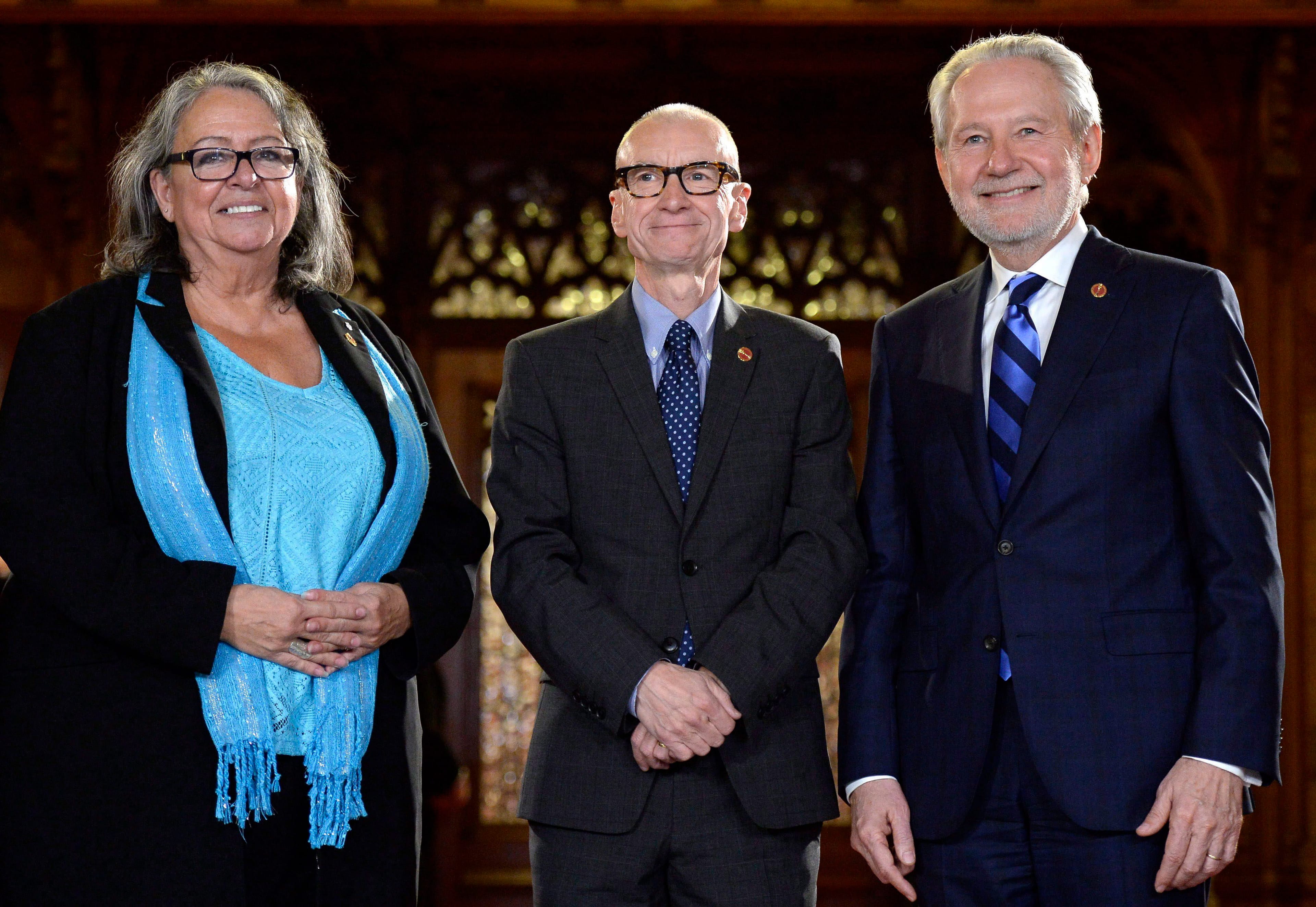 Tony Dean (centre) stands with Senator Frances Lankin (left) and Senator Peter Harder before being sworn in during a ceremony in the Senate on Parliament Hill, Wednesday, Nov. 16, 2016. (THE CANADIAN PRESS/Justin Tang)