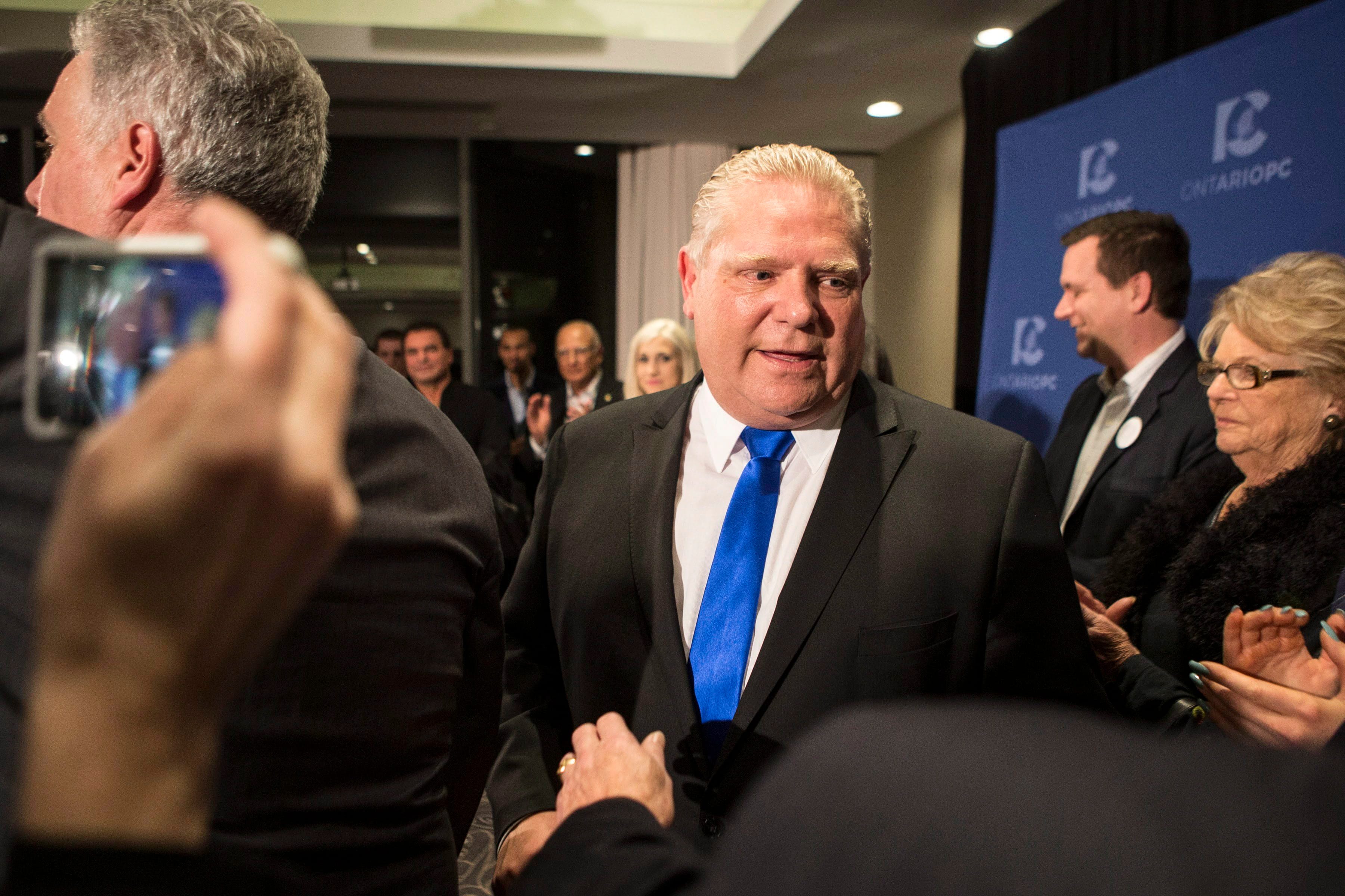 Doug Ford leaves a press conference after being named as the newly elected leader of the Ontario Progressive Conservatives at the delayed Ontario PC Leadership announcement in Markham, Ont., on Saturday, March 10, 2018. THE CANADIAN PRESS/Chris Young