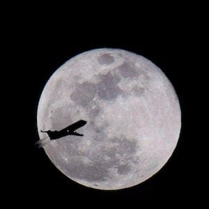 A airplane flying over Norfolk, Va., is silhouetted by the full moon on Wednesday, Jan. 31, 2018. A national pilots associaiton is raising alarm bells over new accident numbers showing a year-over-year jump in incidents involving commercial airliners. THE CANADIAN PRESS/AP-L. Todd Spencer/The Virginian-Pilot via AP