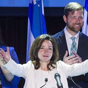 Newly acclaimed Bloc Quebecois leader Martine Ouellet salutes supporters during a rally Saturday, March 18, 2017 in Montreal. Seven of the 10 Bloc Quebecois MPs quit Wednesday because of Martine Ouellet's leadership style, leaving the once-powerful party in complete disarray. THE CANADIAN PRESS/Paul Chiasson