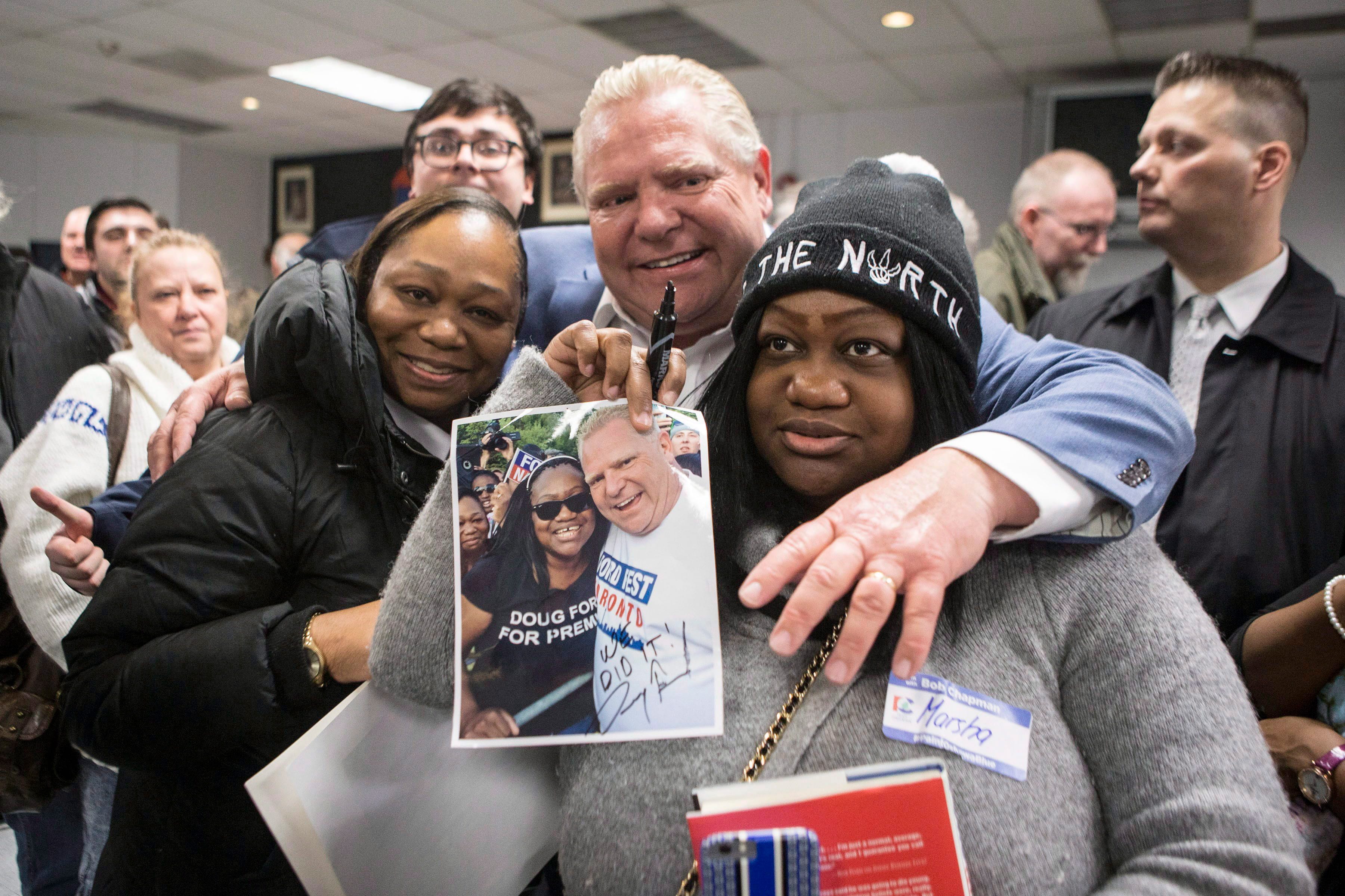 Ontario PC Leader Doug Ford poses for a photo with supporters following a campaign rally in Oshawa, Ont., on Saturday, March 24, 2018. (THE CANADIAN PRESS/Chris Young)