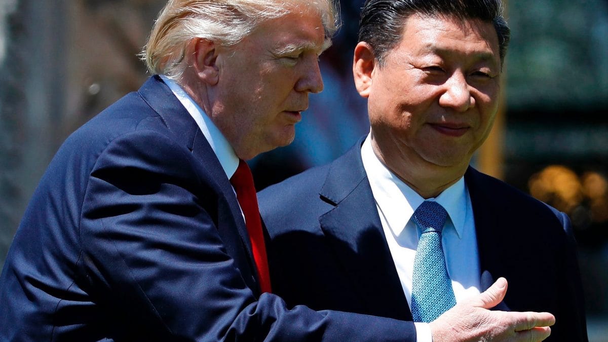 U.S. President Donald Trump gestures as he and Chinese President Xi Jinping walk after their meetings at Mar-a-Lago in Palm Beach, Fla. in April 2017.(AP Photo/Alex Brandon, File)