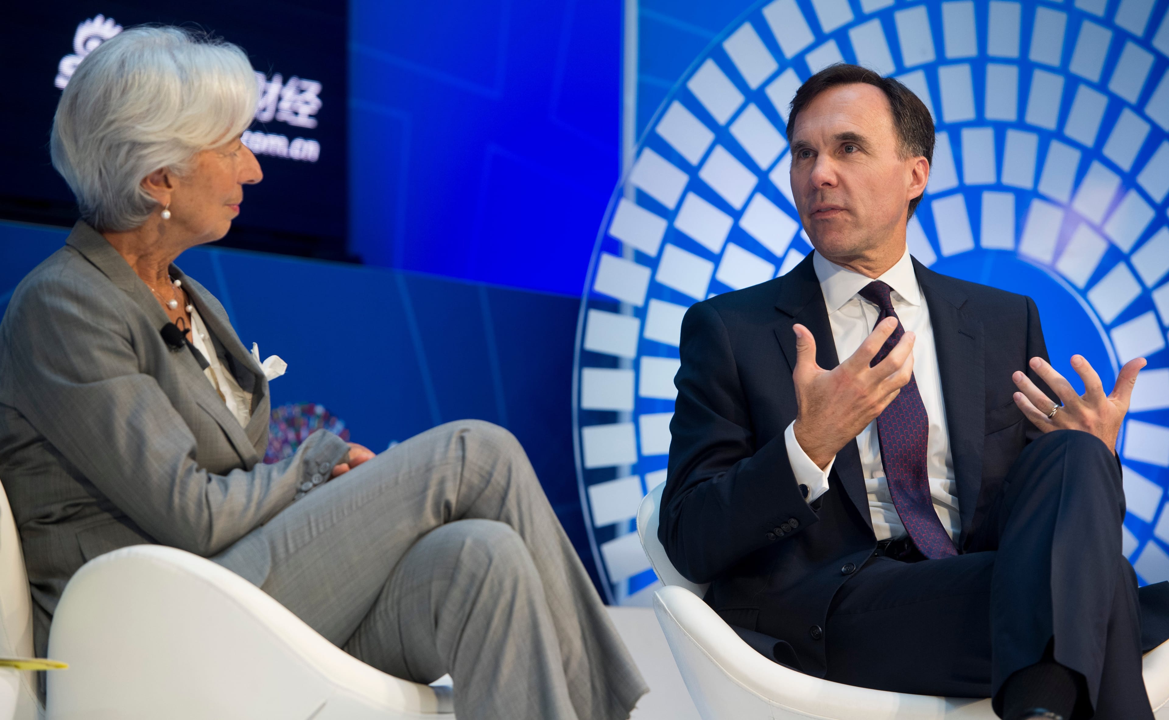 Canadian Minister of Finance William Morneau (R) speaks alongside IMF Managing Director Christine Lagarde during a CNN Debate on the Global Economy during the World Bank Group / International Monetary Fund Annual Meetings at IMF Headquarters in Washington, DC, October 12, 2017. / AFP PHOTO / SAUL LOEB (Photo credit should read SAUL LOEB/AFP/Getty Images)