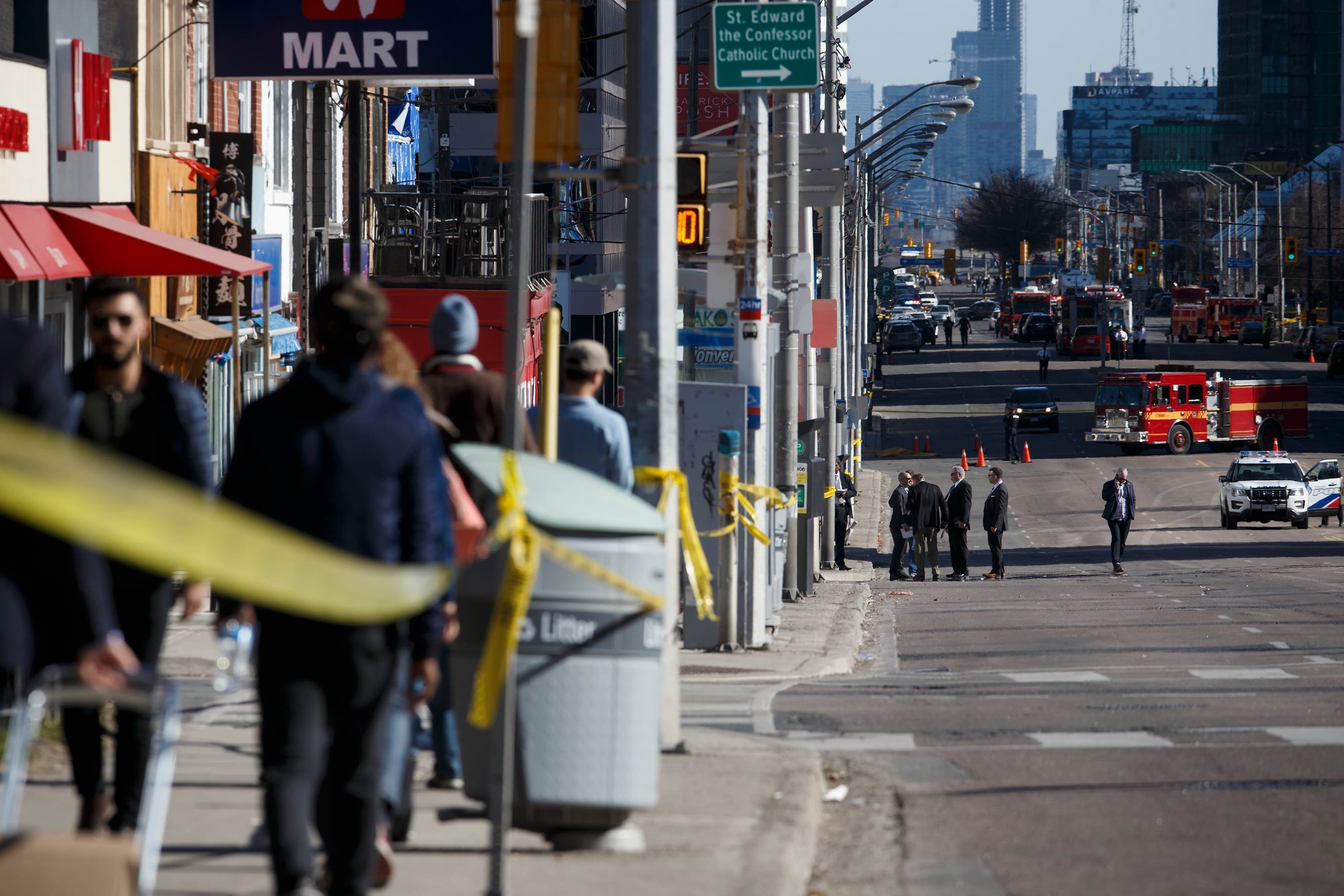 Police work the scene on Yonge St. at near Finch Ave., after a van plowed into pedestrians on April 23, 2018 in Toronto, Canada. A suspect identified as Alek Minassian, 25, is in custody after a driver in a white rental van collided with multiple pedestrians killing nine and injuring at least 16. (Cole Burston/Getty Images)