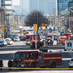 First responders close down Yonge Street in Toronto after a van mounted a sidewalk crashing into a number of pedestrians on Monday, April 23, 2018. THE CANADIAN PRESS/Nathan Denette