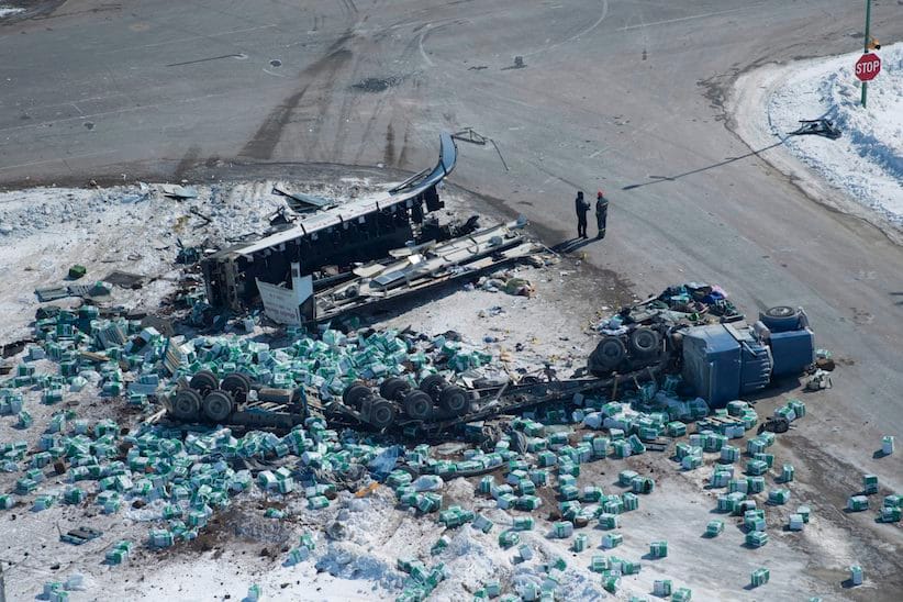 The wreckage of a fatal crash outside of Tisdale, Sask., is seen Saturday, April, 7, 2018. A bus carrying the Humboldt Broncos hockey team crashed into a truck en route to Nipawin for a game Friday night killing 14 and sending over a dozen more to the hospital. THE CANADIAN PRESS/Jonathan Hayward