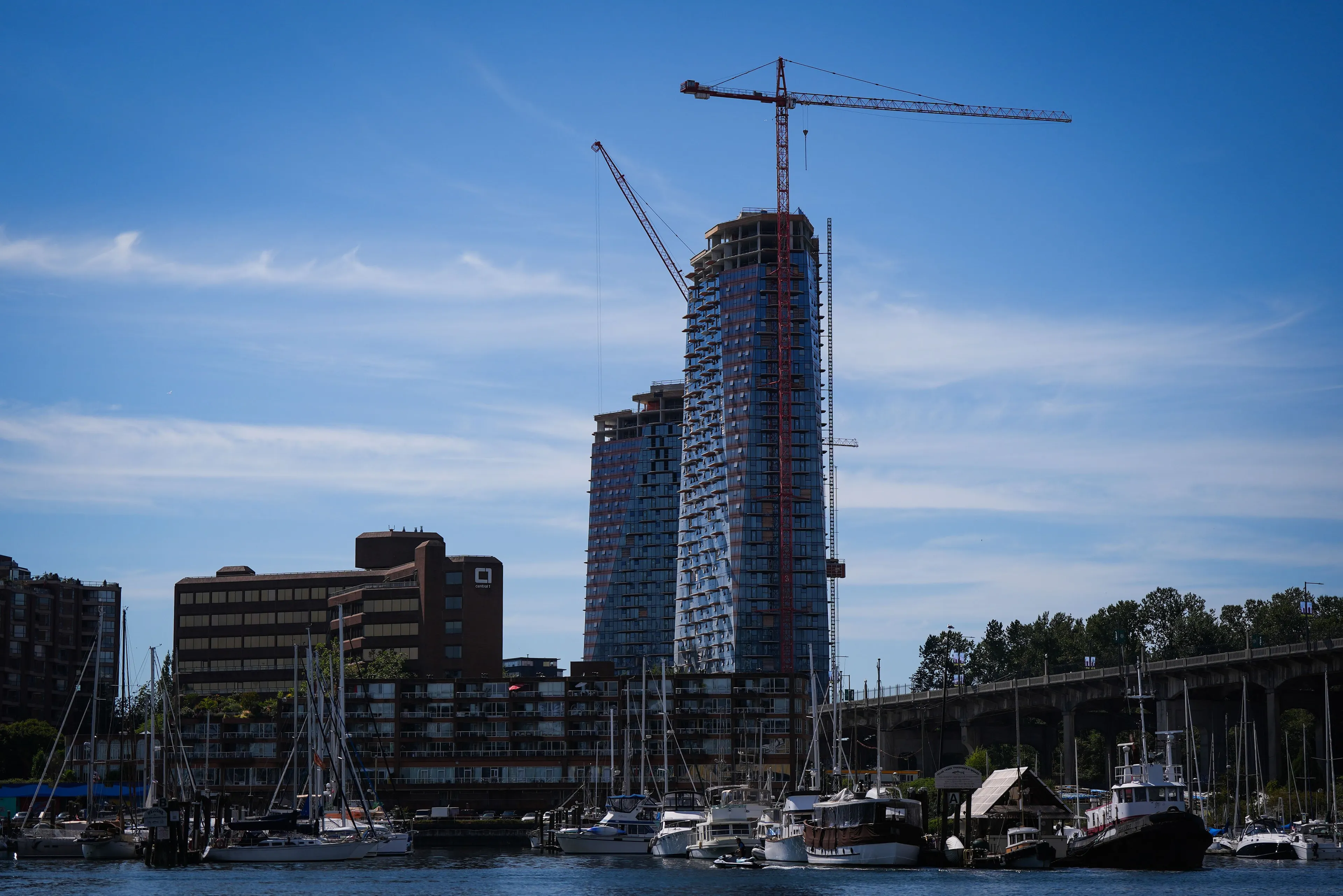 Senakw, an Indigenous-led housing development in CAnada, photographed against a muted blue sky