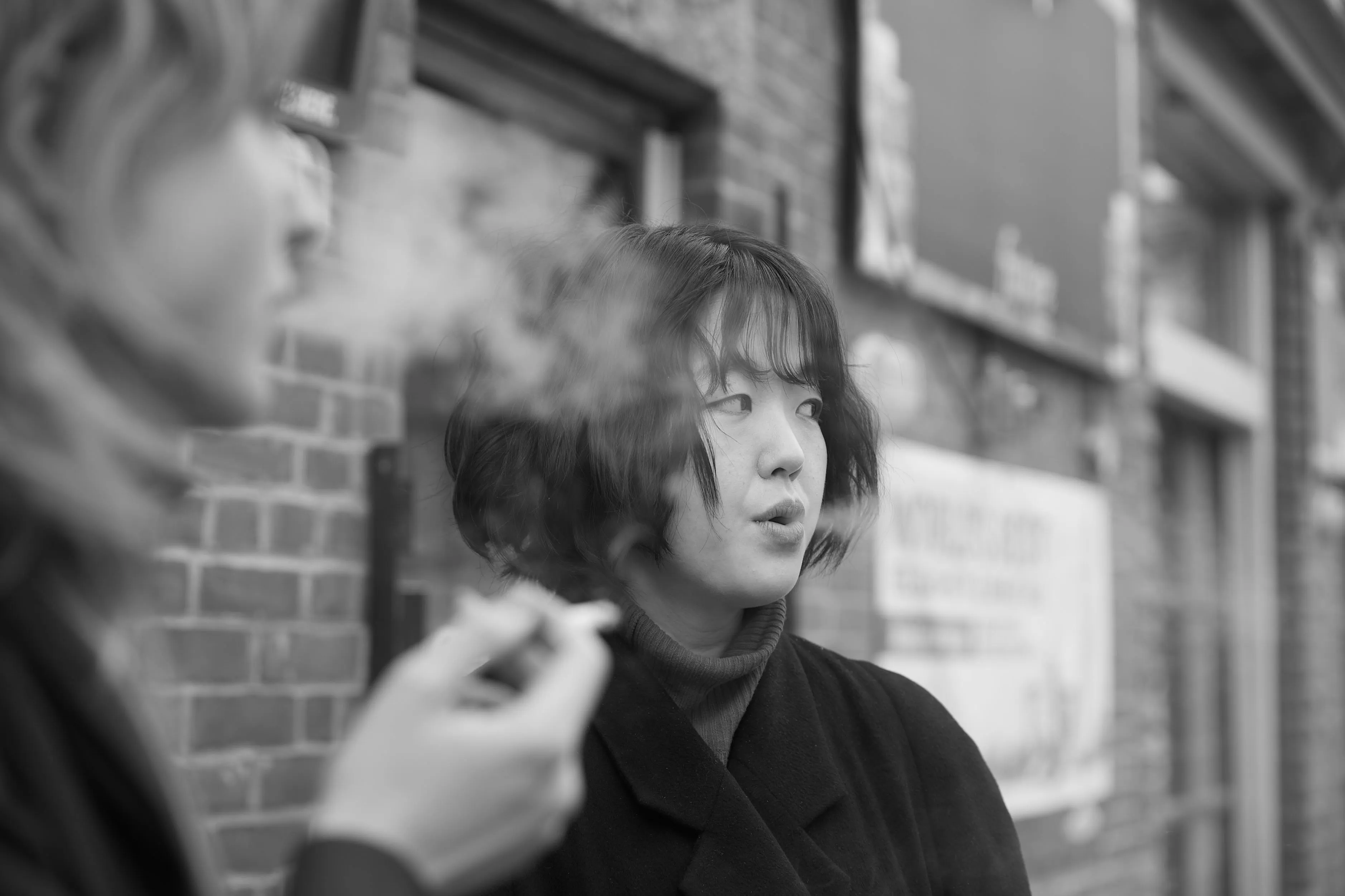 Two young women smoking