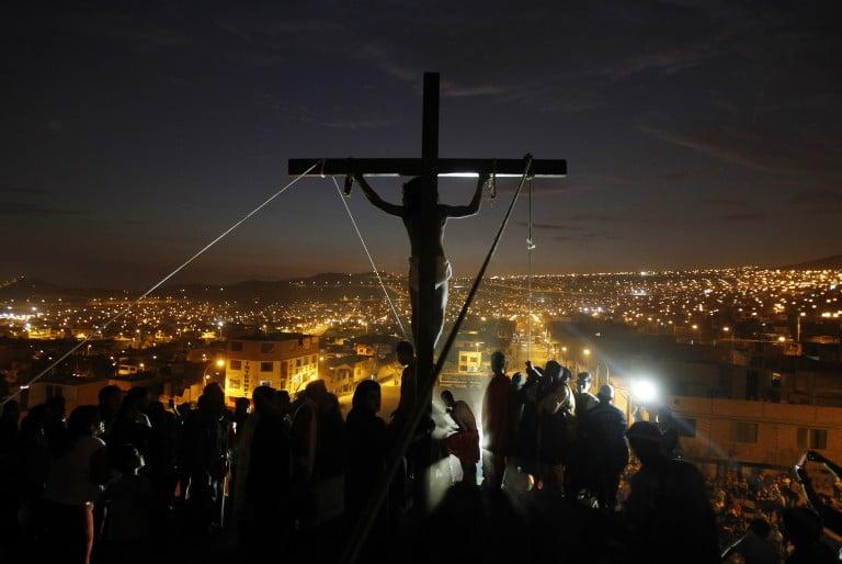 <p>An actor playing the role of Jesus Christ hangs from a cross during the re-enactment of the crucifixion of Jesus Christ during Holy Week at Mi Peru, a shanty town on the outskirts of Lima April 17, 2014. Holy Week is celebrated in many Christian traditions during the week before Easter. REUTERS/Enrique Castro-Mendivil (PERU &#8211; Tags: RELIGION TPX IMAGES OF THE DAY SOCIETY) &#8211; RTR3LR6T</p>

