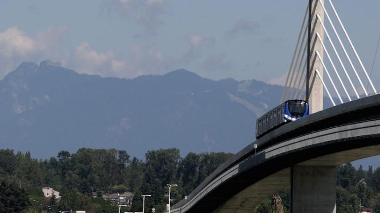 <p>A Canada Line rapid transit train crosses over the Fraser River from Vancouver to Richmond, B.C., as Grouse Mountain is seen in the distance on Sunday August 16, 2009. The train linking Vancouver with Richmond and the Vancouver International Airport officially opens to the public on Monday. It will be a key part of the transportation during the Vancouver 2010 Winter Olympic Games. THE CANADIAN PRESS/Darryl Dyck</p>
