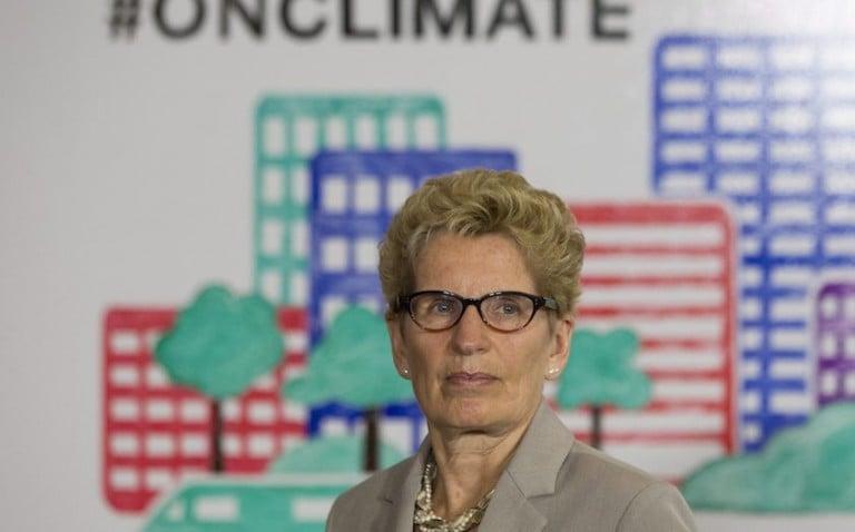 <p>Ontario Premier Kathleen Wynne listens to questions from the media during an announcement which outlined a cap and trade deal with Quebec aimed at curbing green house emissions, in Toronto on Monday, April 13 2015. The plan involves government-imposed limits on emissions from companies, and those that want to burn more fossil fuels can buy carbon credits from those that burn less than they are allowed. THE CANADIAN PRESS/Chris Young</p>
