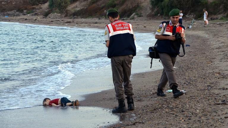 <p>Paramilitary police officers investigate the scene before carrying the lifeless body of Aylan Kurdi, 3, after a number of migrants died and a smaller number were reported missing after boats carrying them to the Greek island of Kos capsized, near the Turkish resort of Bodrum early Wednesday, Sept. 2, 2015. The family — Abdullah, his wife Rehan and their two boys, 3-year-old Aylan and 5-year-old Galip — embarked on the perilous boat journey only after their bid to move to Canada was rejected. The tides also washed up the bodies of Rehan and Galip on Turkey&#8217;s Bodrum peninsula Wednesday, Abdullah survived the tragedy. AP</p>

