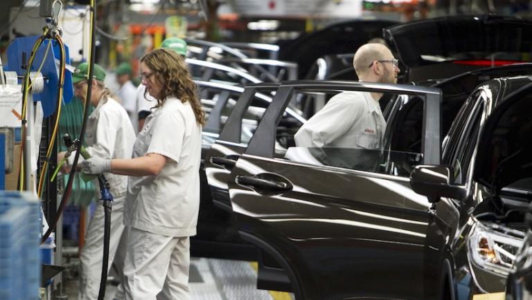 <p>Production Associates inspect cars moving along assembly line at Honda manufacturing plant in Alliston, Ontario. REUTERS/Fred Thornhill </p>
