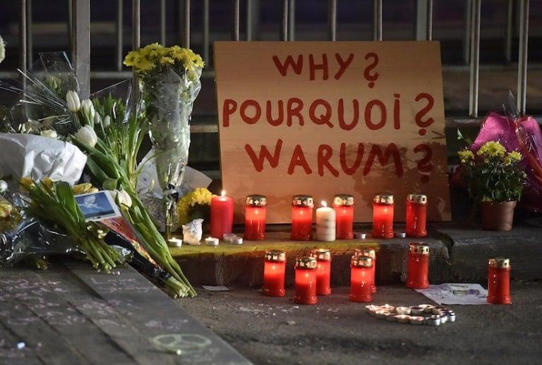 <p>A sign reads &#8220;Why?&#8221; in English, French and Flemish behind candles and flowers near the Maelbeek metro station, in Brussels on Wednesday evening, March 23, 2016. Bombs exploded Tuesday at Brussels airport and one of the city&#8217;s metro stations, killing and wounding scores of people, as a European capital was again locked down amid heightened security threats. (AP Photo/Martin Meissner)</p>
