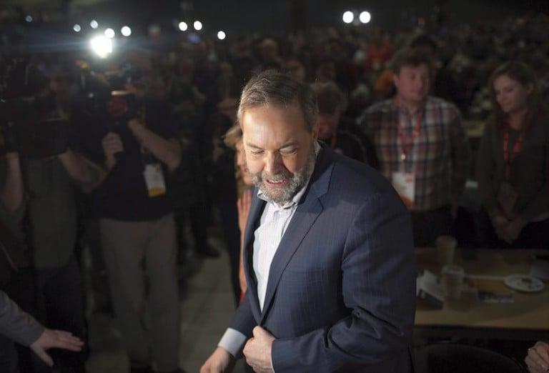 <p>Federal NDP Leader Tom Mulcair makes his way to his seat after his speech during the 2016 NDP Federal Convention in Edmonton Alta, on Sunday, April 10, 2016. (Jason Franson/CP)</p>
