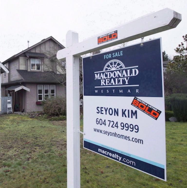 <p>A sold home is pictured in Vancouver, B.C., Thursday, Feb. 11, 2016. Canada Mortgage and Housing Corporation says there is mounting evidence that house prices in a number of Canadian cities are out of whack with incomes and other economic fundamentals.The latest report from CMHC says there is evidence of overvaluation in nine of the 15 real estate markets included in the research. THE CANADIAN PRESS/Jonathan Hayward</p>
