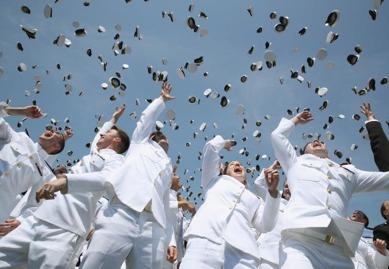 <p>U.S. Naval Academy graduates toss their hats in the air during graduation ceremonies at the U.S. Naval Academy May 27, 2016 in Annapolis, Maryland. This is the first year that females wore the same uniform as the males.   (Mark Wilson/Getty Images)</p>
