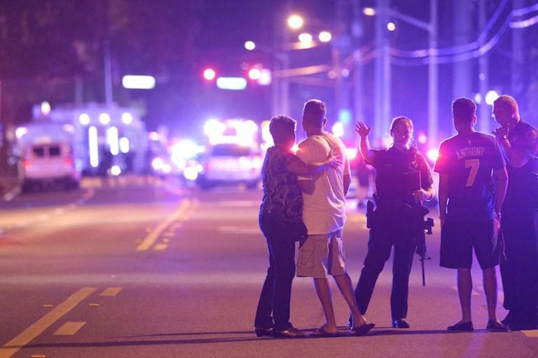<p>Orlando Police officers direct family members away from a fatal shooting at Pulse Orlando nightclub in Orlando, Fla., Sunday, June 12, 2016. (AP Photo/Phelan M. Ebenhack)</p>
