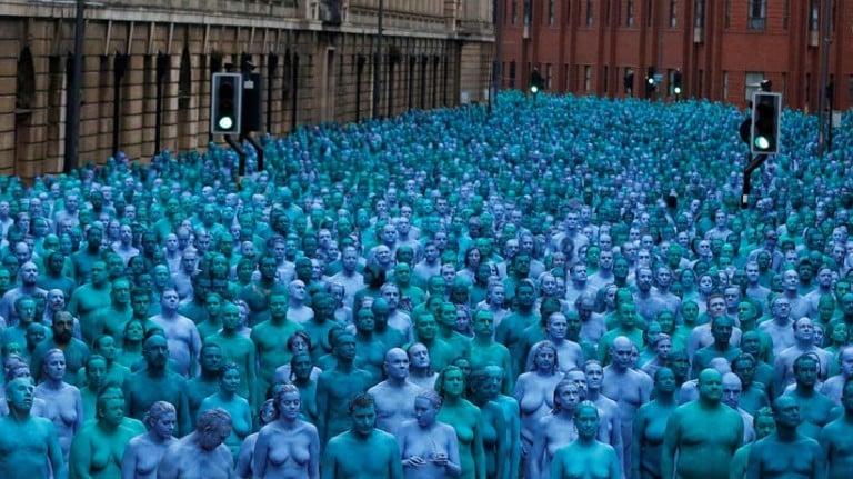 <p>Deep blue sea<br />
American artist Spencer Tunick corrals a sea of nude blue people for a project called Sea of Hull  (Andrew Yates/Reuters)</p>
