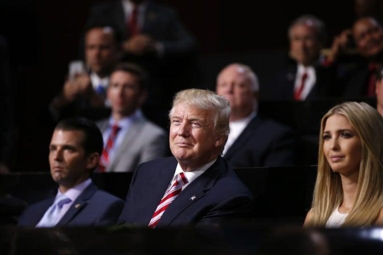 <p>Republican Presidential Candidate Donald Trump, centre, watches with Donald Trump, Jr., left, and Ivanka Trump as his son Eric Trump addresses the delegates during the third day session of the Republican National Convention in Cleveland, Wednesday, July 20, 2016. (AP Photo/Matt Rourke)</p>

