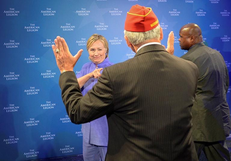 <p>Democratic presidential nominee Hillary Clinton winks at the National Commander of the American Legion Dale Barnett after she addressed the National Convention in Cincinnati, Ohio, U.S., August 31, 2016. (Bryan Woolston/Reuters)</p>
