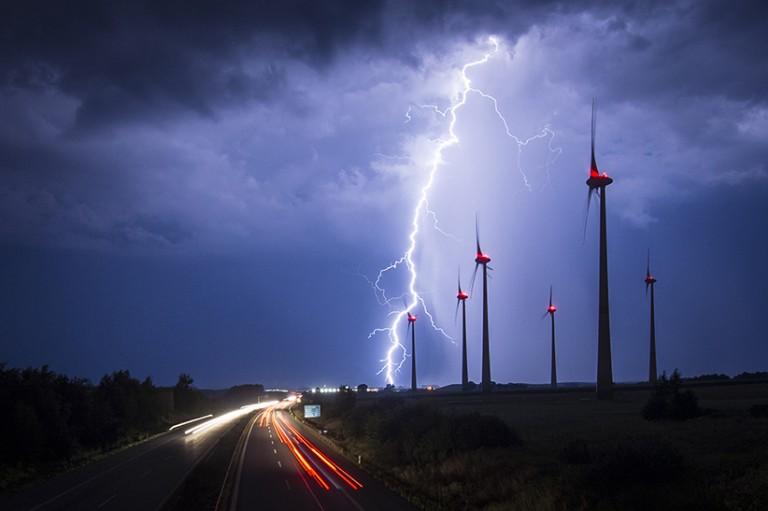 <p>Lightning strikes behind wind turbines during a thunderstorm near the border between Germany and Poland on August 28, 2016 in Goerlitz, Germany. After a hot weekend across Germany, the weather is cooling down. (Florian Gaertner/Photothek/Getty Images)</p>
