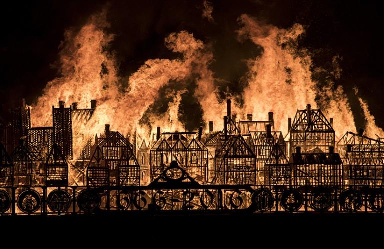 <p>A 120-metre long wooden model of London&#8217;s 17th-century skyline burns on the River Thames after it was set alight in a dramatic retelling of the story of the Great Fire of London on September 4, 2016 in London, England. The event commemorated the 350th anniversary of the Great Fire of London.  (John Phillips/Getty Images)</p>
