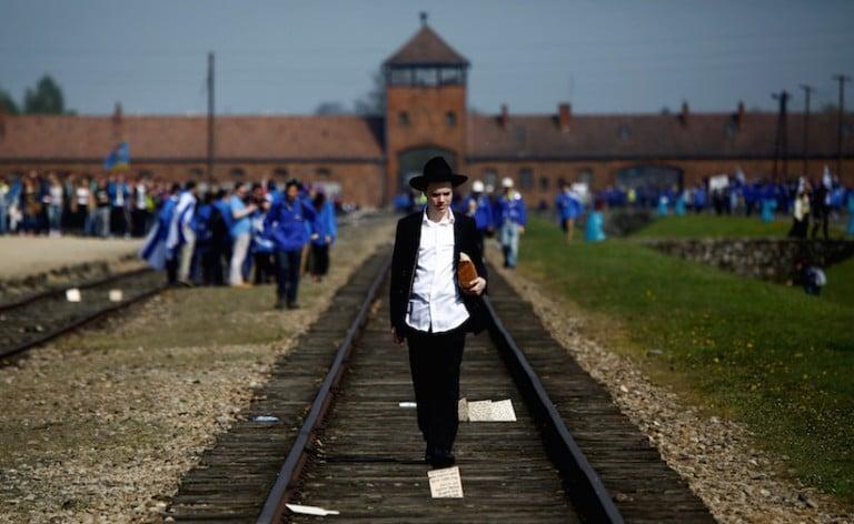 <p>A man walks on the railway tracks in the former Nazi death camp of Auschwitz-Birkenau in May 2016. REUTERS/Kacper Pempel</p>

