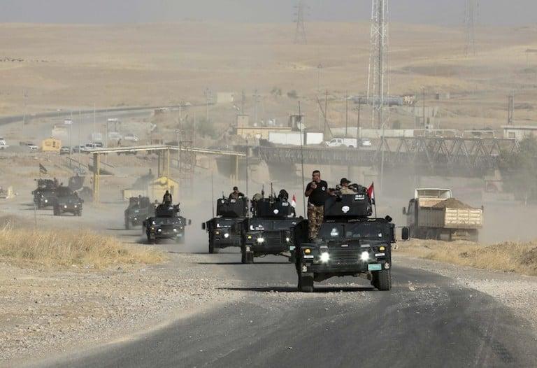 <p>Iraqi special forces advance towards the city of Mosul, Iraq, Wednesday, Oct. 19, 2016. A senior Iraqi general on Wednesday called on Iraqis fighting for the Islamic State group in Mosul to surrender as a wide-scale operation to retake the militant-held city entered its third day. (AP Photo/Khalid Mohammed)</p>
