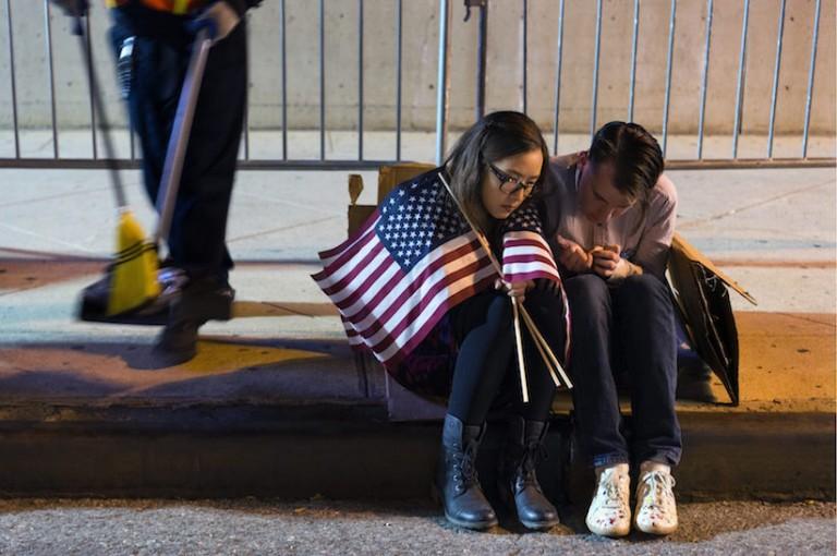 <p>People sit outside the Jacob Javits Center waiting for election results following a rally for Democratic presidential candidate Hillary Clinton in New York Wednesday, Nov. 9, 2016. (AP Photo/Craig Ruttle)</p>
