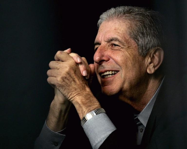 <p>Leonard Cohen Listens to partner Anjani Thomas sing to thousands of people, while taking a seat at the back of the stage during a free concert on Saturday, May. 13, 2006 in Toronto, Ont.<br />
(CP PHOTO/Nathan Denette)</p>
