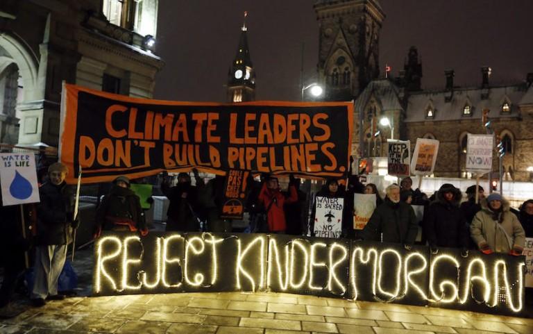 <p>People protest against the proposed Kinder Morgan pipeline outside Prime Minister Justin Trudeau&#8217;s office, below Parliament Hill on November 21, 2016. THE CANADIAN PRESS/Fred Chartrand</p>
