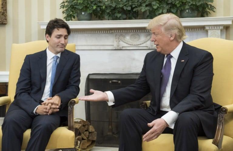 <p>U.S. President Donald Trump (R) extends his hand to Prime Minister Justin Trudeau of Canada during a meeting in the Oval Office at the White House on February 13, 2017 in Washington, D.C. This is the first time the two leaders are meeting at the White House. (Kevin Dietsch/Pool/Getty Images)</p>
