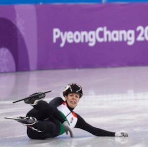 speed skaters, two of them falling down