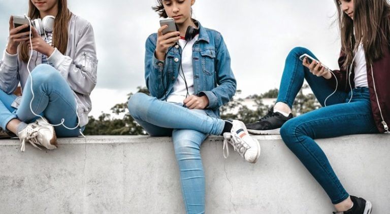 Teenage girls texting