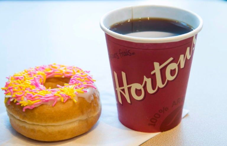 A coffee and donut from Tim Hortons is shown at a Coquitlam B.C., location on Thursday, April 26, 2018. (Jonathan Hayward/CP)